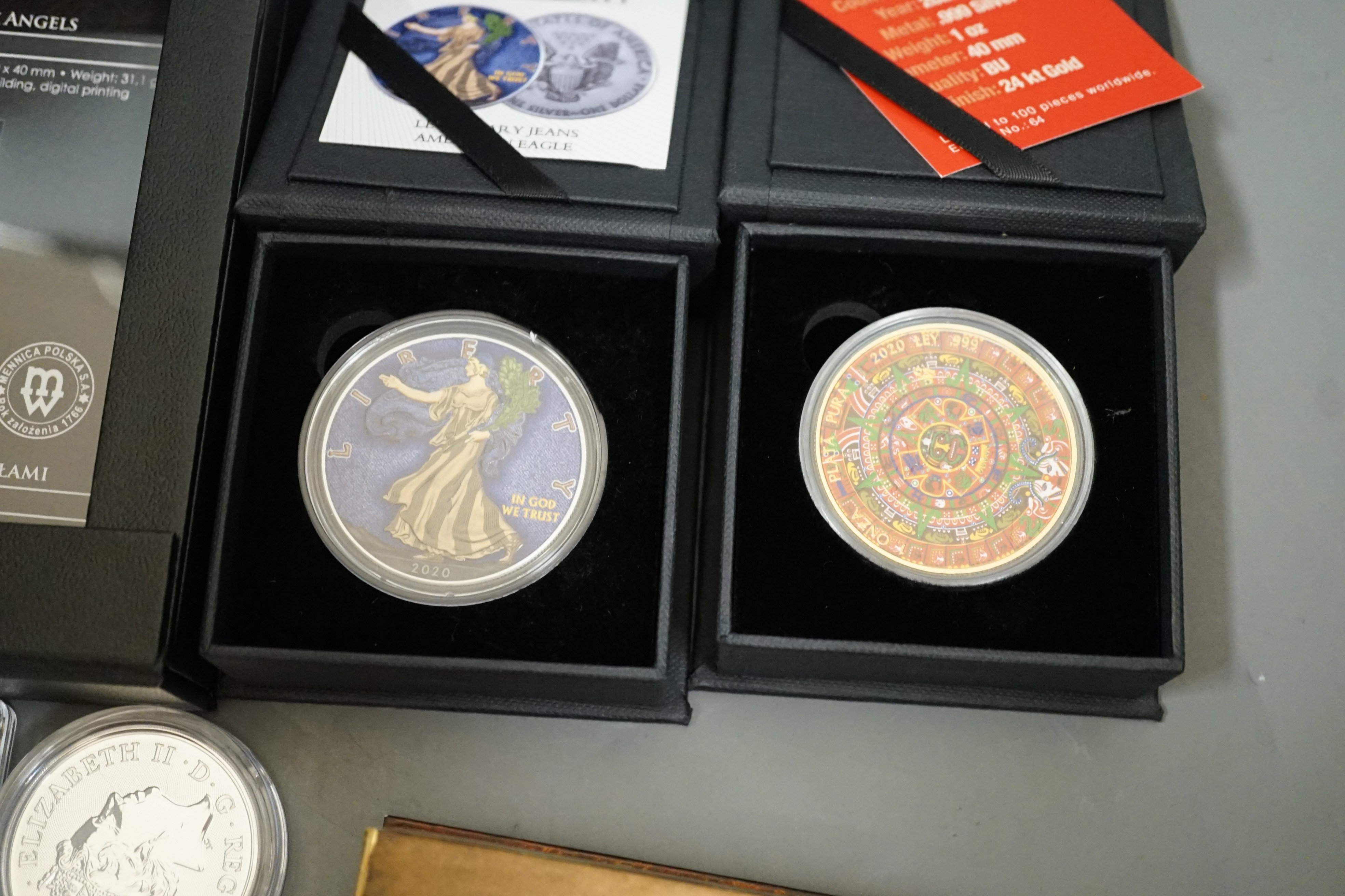Ten bullion silver 1oz. commemorative coins, a bullion silver 2oz. coin and a Canada 2oz. silver ingot, BU